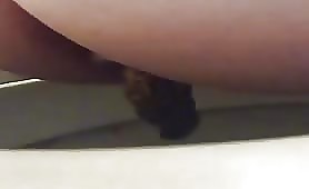 Sexy babe shitting in toilet