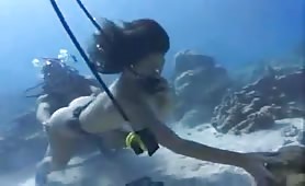 Two Japanese girls pooping underwater