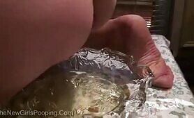Busty babe shits a lot in glass bowl