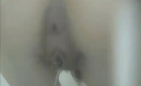 Hairy babe shitting a lot over toilet