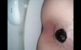 Girl shitting a dark turd in the toilet 