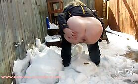 Pooping in a snowy back yard 