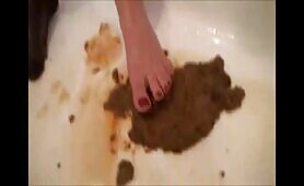 Babe shitting in the bathroom and put her nylon feet on it