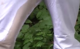 Tattooed babe shitting near parked car