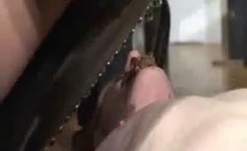 Dark haired mistress pooping on her slave