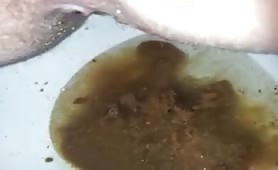 Sexy babe pooping in toilet