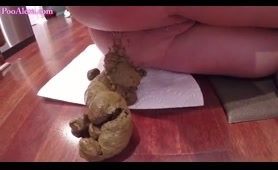 Blonde Pushes Out a Huge Turd in a Floor Close-Up
