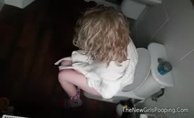 Spying on a blonde babe shitting