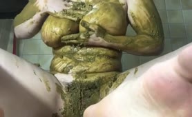 Smearing green shit on entire body