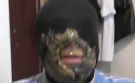 Masked guy smears poop