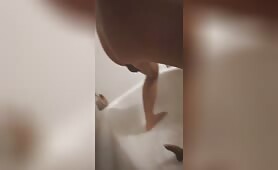 Tattooed babe shitting in bathtub