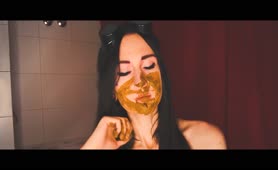 Dark haired teen covered entire face with poop