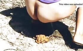 Nasty chick pooping on the rock 