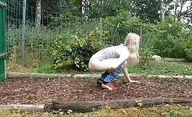 Cute blonde babe pooping outdoor 