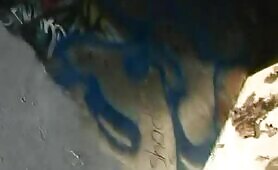 Pretty blonde pooping under a bridge