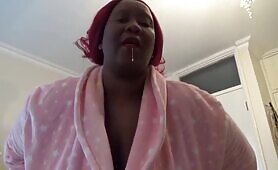 Busty Lady Holds Black Bag and Shits on Pink Robe