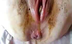 Busty Woman Pushes Shit Into Her Pussy in Close-Up