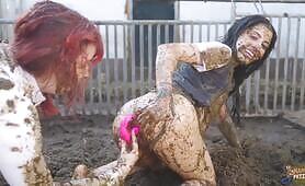 Two Women Mud Play and Shit on a Wooden Fence